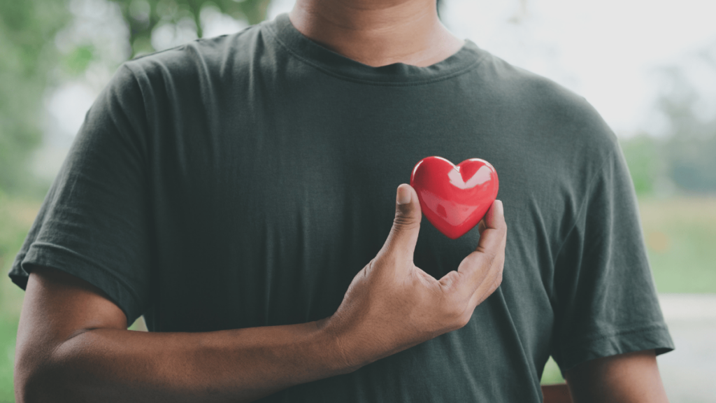 person holding a heart figure