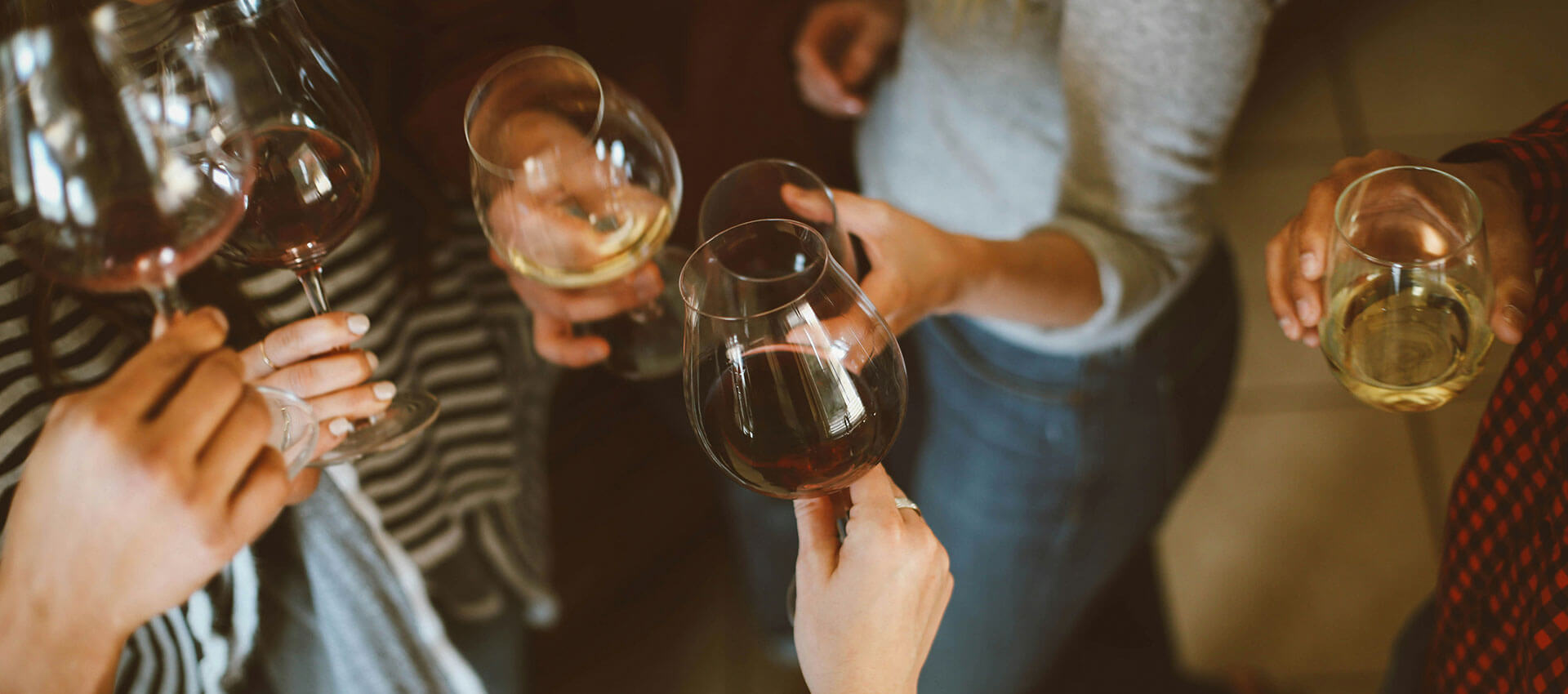 wine glasses with varying amount of alcohol in