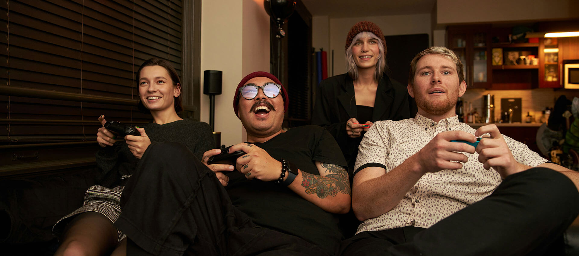 group of friends enjoying playing a video game