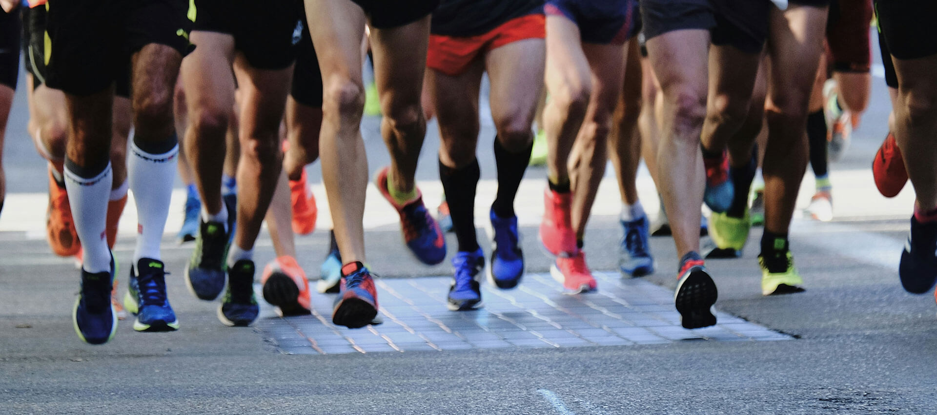 group of runners on a road