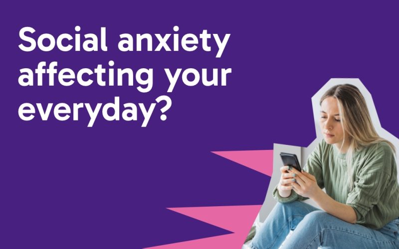 Purple background, with white text saying 'social anxiety affecting your everyday' and a cut out of an image of a teenage girl looking sat on her bed on her phone.